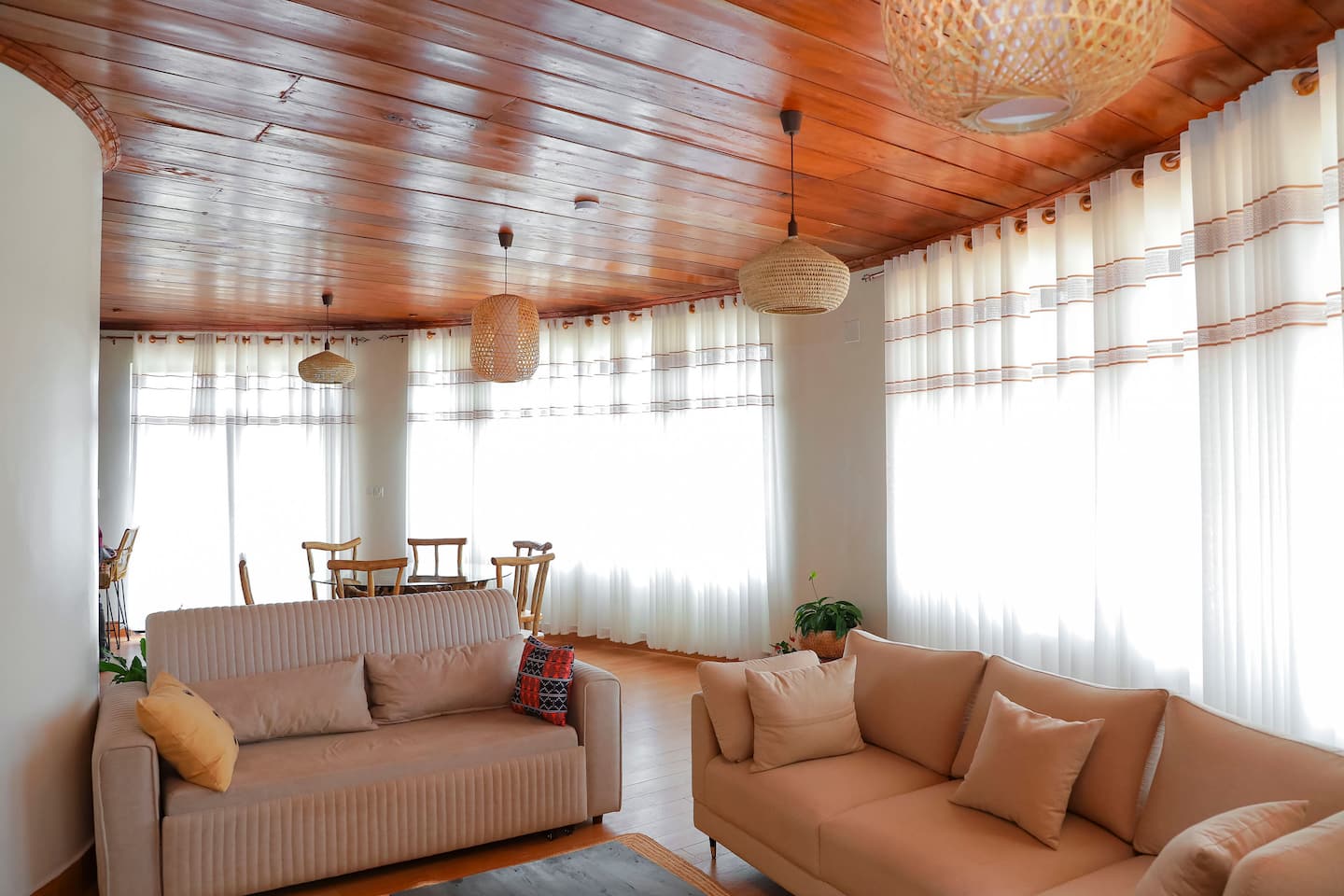 Bright curved living room with lake views